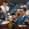 Idham Arsyad saat mengikuti ujian terbuka doktor di Universitas Brawijaya, Malang, Selasa (14/7).